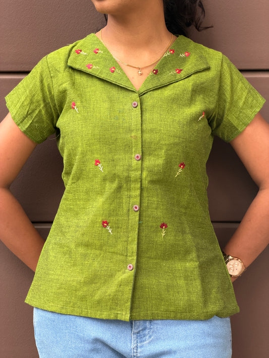 Green shirt with floral patterns